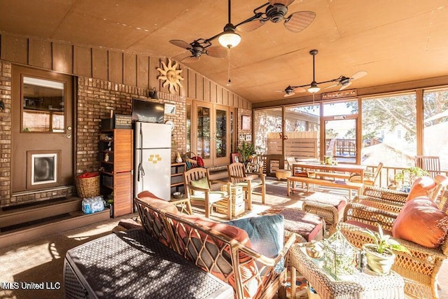 sunroom featuring lofted ceiling