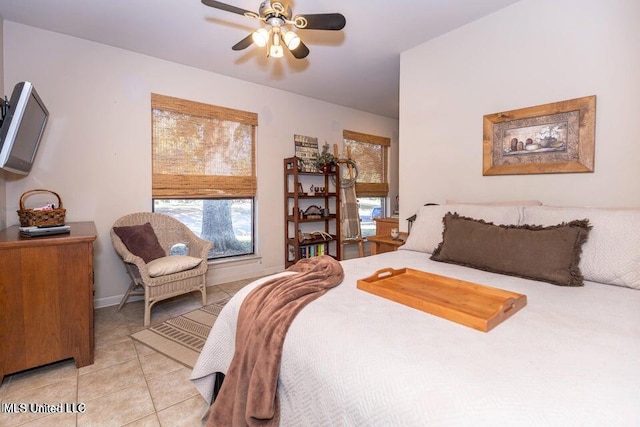 bedroom with ceiling fan and light tile patterned flooring