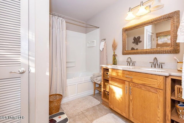 bathroom with tile patterned flooring, shower / tub combo, and vanity