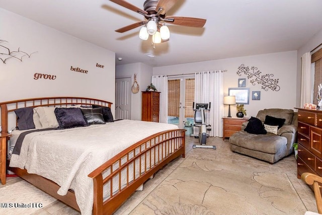 bedroom with access to exterior, ceiling fan, and french doors