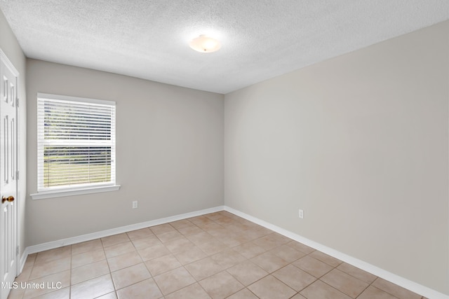 20 Lakeview Dr, Ocean Springs, MS 39564 - spare room featuring a textured ceiling and light tile patterned flooring