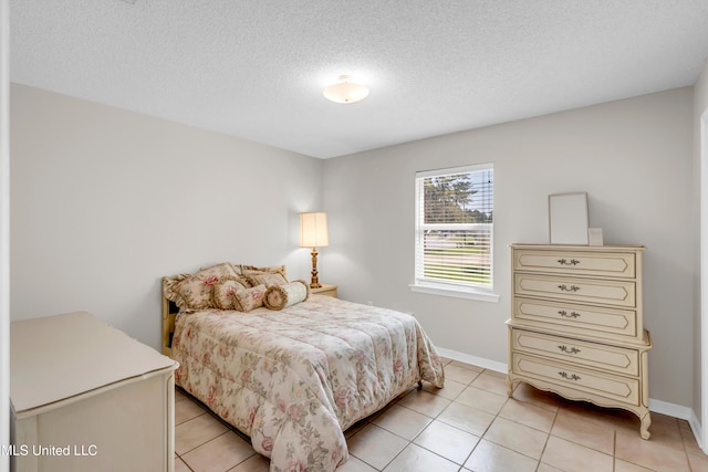 20 Lakeview Dr, Ocean Springs, MS 39564 - bedroom with light tile patterned flooring and a textured ceiling