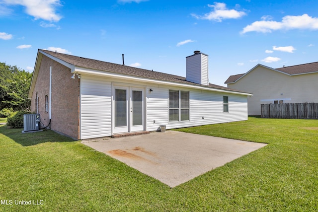 20 Lakeview Dr, Ocean Springs, MS 39564 - back of property with brick siding, a patio, a chimney, and a shingled roof