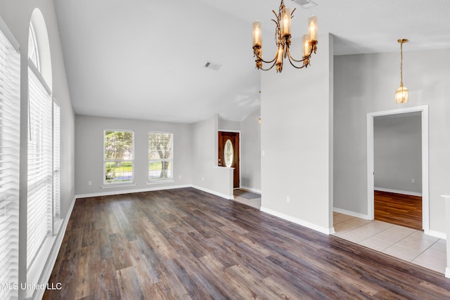 20 Lakeview Dr, Ocean Springs, MS 39564 - unfurnished living room with wood finished floors, lofted ceiling, and a chandelier