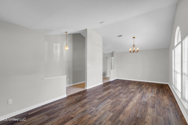 20 Lakeview Dr, Ocean Springs, MS 39564 - spare room featuring vaulted ceiling, wood finished floors, a chandelier, and plenty of natural light