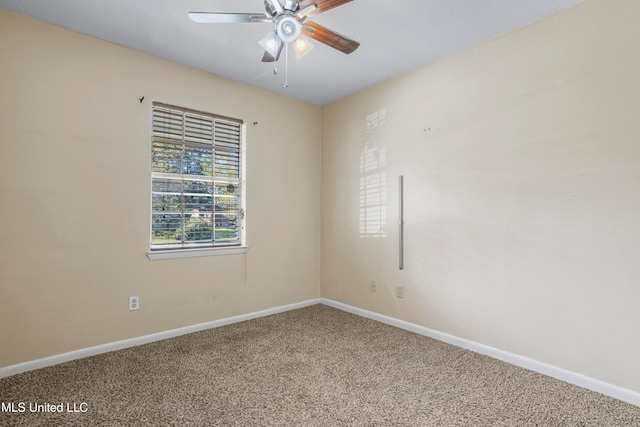 empty room with carpet floors and ceiling fan