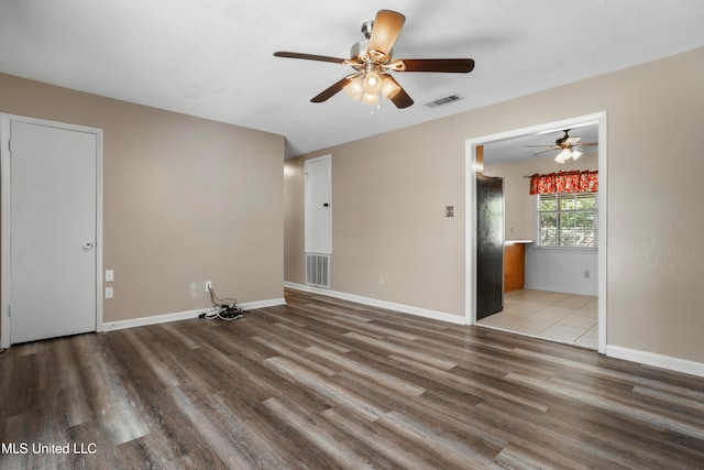 unfurnished room with light hardwood / wood-style flooring and ceiling fan