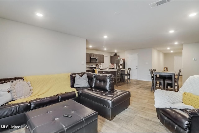 living room with light hardwood / wood-style floors