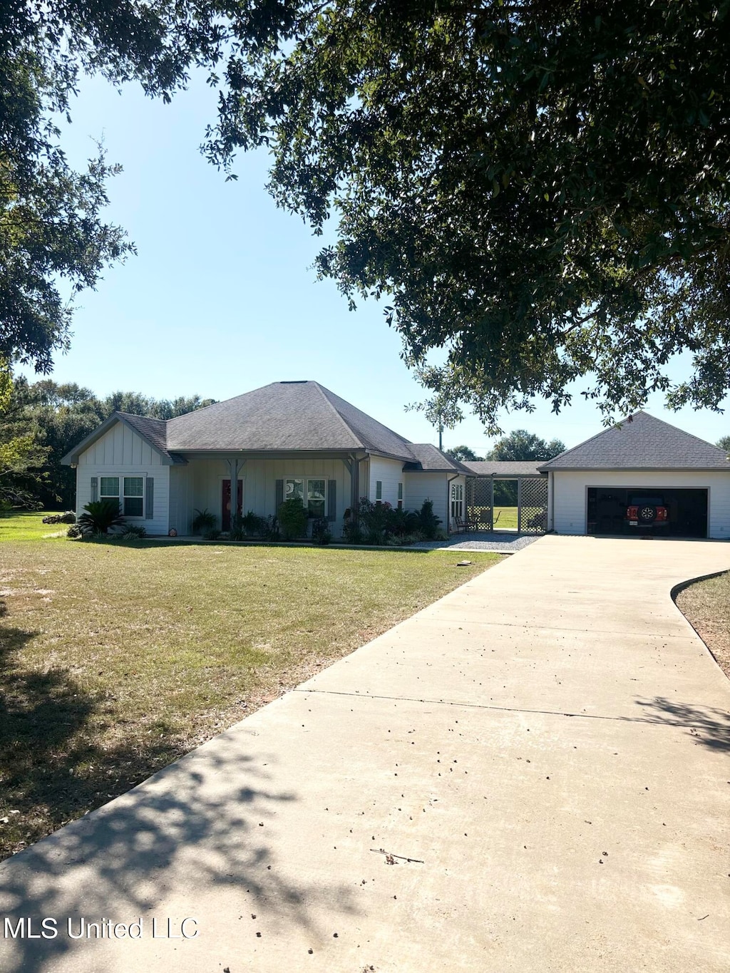 ranch-style house with a front yard and a garage