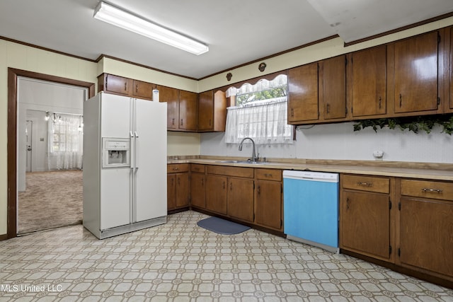 2900 7th Ave, Gulfport, MS 39501 - kitchen featuring white refrigerator with ice dispenser, dishwasher, a sink, light countertops, and light flooring