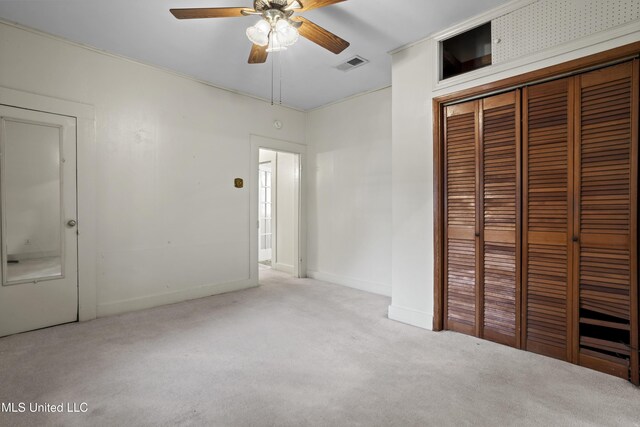 2900 7th Ave, Gulfport, MS 39501 - unfurnished bedroom featuring carpet flooring, baseboards, a closet, and ceiling fan