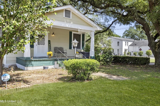 2900 7th Ave, Gulfport, MS 39501 - view of front of house featuring covered porch and a front yard