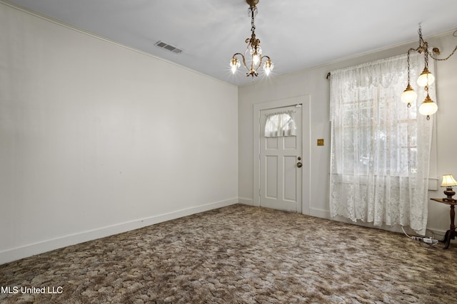 2900 7th Ave, Gulfport, MS 39501 - entrance foyer featuring ornamental molding, a chandelier, carpet flooring, and baseboards