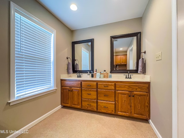 1104 SE 2nd St, Magee, MS 39111 - full bath with double vanity and baseboards