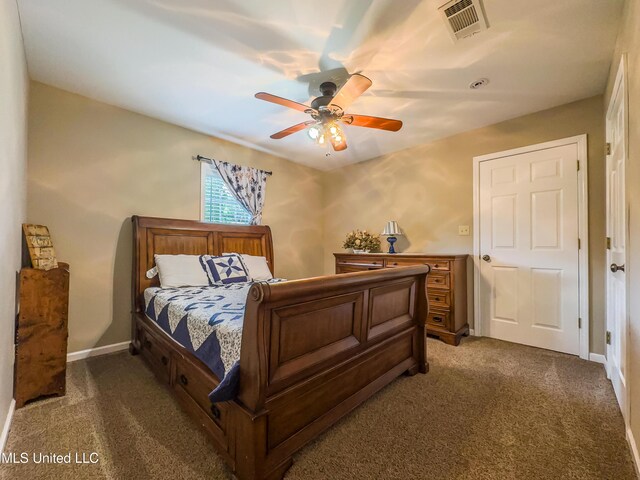 1104 SE 2nd St, Magee, MS 39111 - bedroom with carpet flooring, baseboards, and a ceiling fan