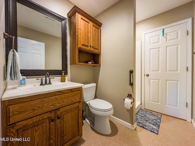 1104 SE 2nd St, Magee, MS 39111 - full bathroom with toilet, baseboards, and vanity