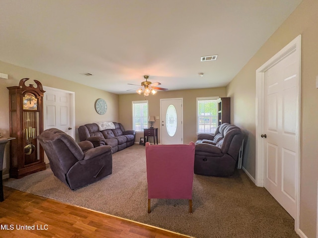 1104 SE 2nd St, Magee, MS 39111 - living area featuring wood finished floors, ceiling fan, and carpet floors