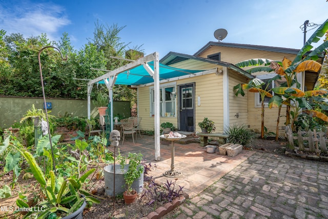 back of house with a patio