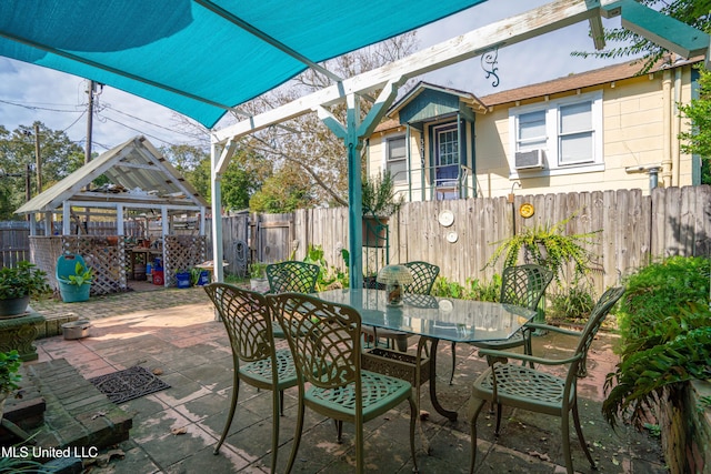 3508 11th St, Gulfport, MS 39501 - fenced backyard featuring outdoor dining space, a gazebo, a patio, and cooling unit