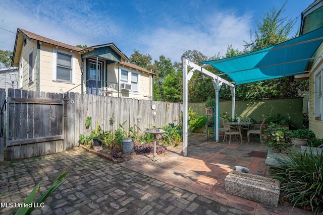 3508 11th St, Gulfport, MS 39501 - fenced backyard with a patio and outdoor dining space
