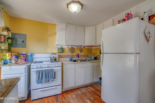3508 11th St, Gulfport, MS 39501 - kitchen with white appliances, a sink, white cabinetry, and hardwood / wood-style flooring