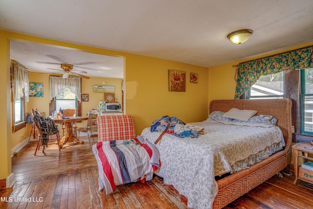 3508 11th St, Gulfport, MS 39501 - bedroom featuring wood-type flooring, a ceiling fan, and baseboards