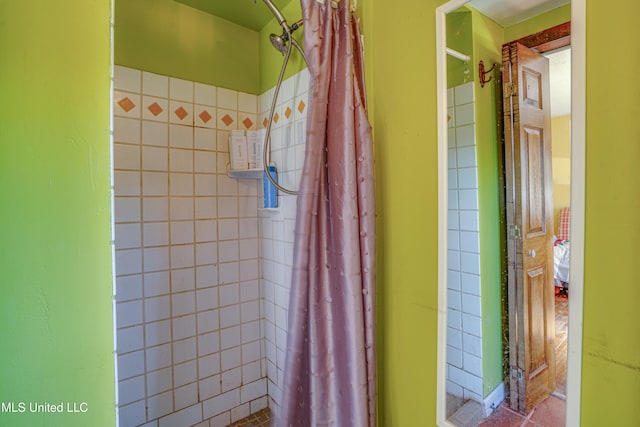 bathroom with a shower with curtain