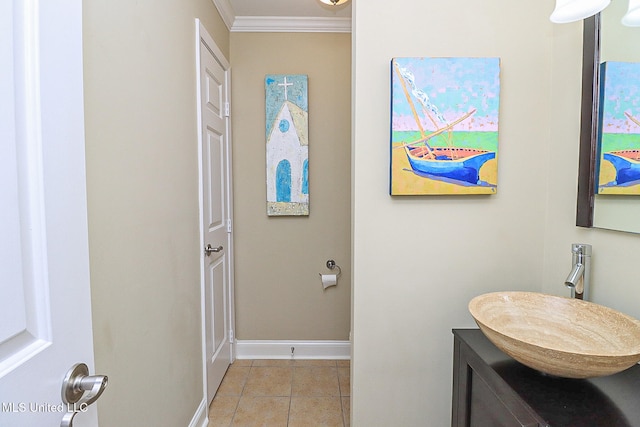 bathroom with tile patterned flooring, vanity, and crown molding