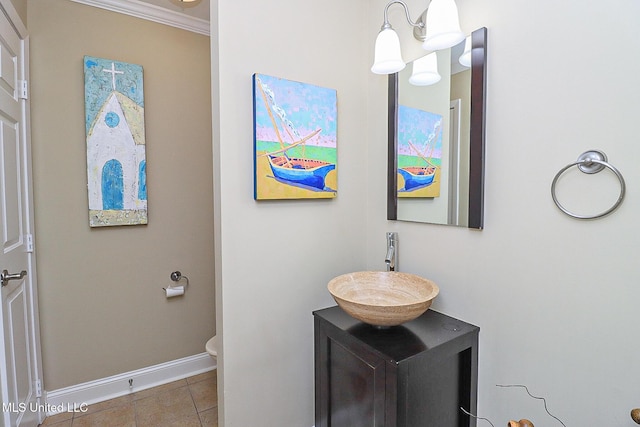 65 Breakers Ln, Ridgeland, MS 39157 - bathroom featuring baseboards, vanity, toilet, tile patterned flooring, and ornamental molding