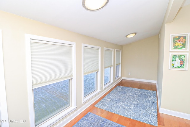 65 Breakers Ln, Ridgeland, MS 39157 - hallway featuring wood finished floors, lofted ceiling, and baseboards