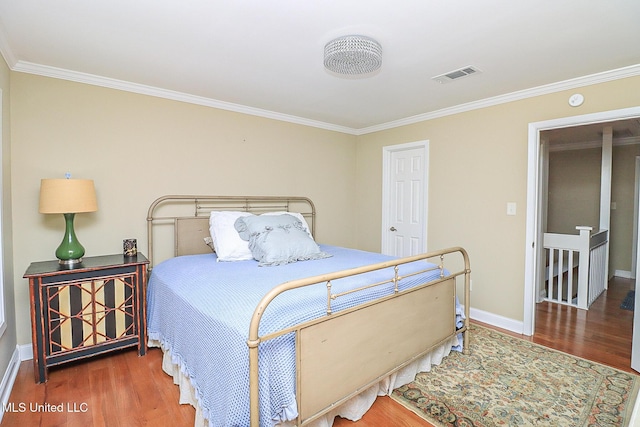 65 Breakers Ln, Ridgeland, MS 39157 - bedroom with ornamental molding, wood finished floors, and baseboards