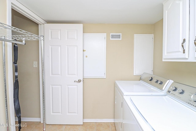 65 Breakers Ln, Ridgeland, MS 39157 - laundry area with washing machine and dryer, cabinet space, baseboards, and light tile patterned floors