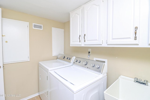 65 Breakers Ln, Ridgeland, MS 39157 - laundry area featuring independent washer and dryer and cabinet space