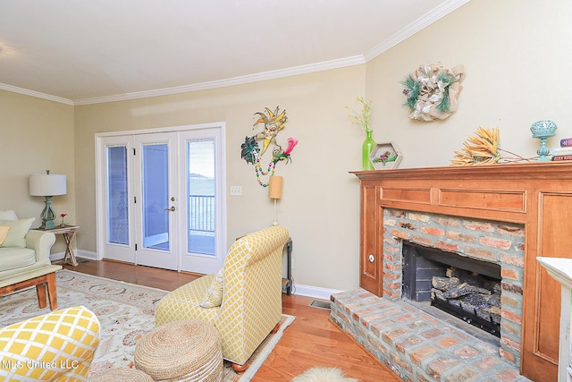 65 Breakers Ln, Ridgeland, MS 39157 - living area with crown molding, wood finished floors, baseboards, and a fireplace