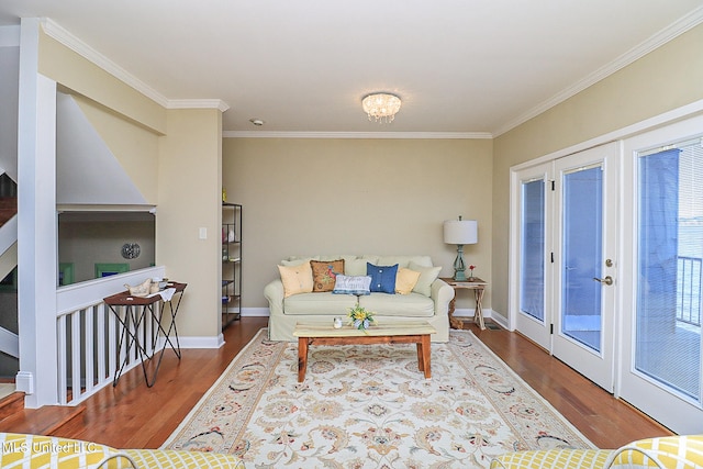 living room with wood-type flooring, ornamental molding, and french doors