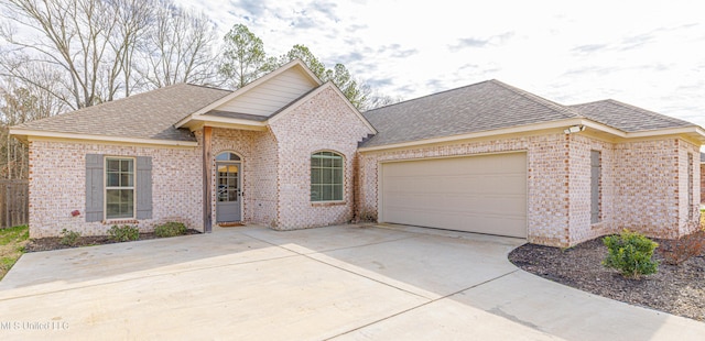 view of front of property with a garage