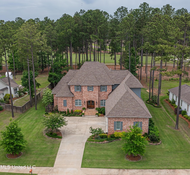 157 Reunion Dr, Madison, MS 39110 - view of front facade featuring brick siding, concrete driveway, and a shingled roof