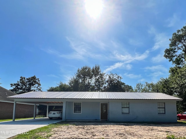 ranch-style home with a carport