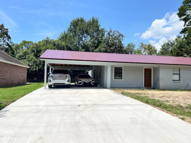 ranch-style home with a carport and a front lawn