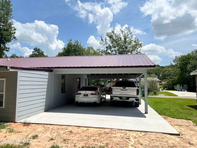 view of car parking featuring a yard and a carport