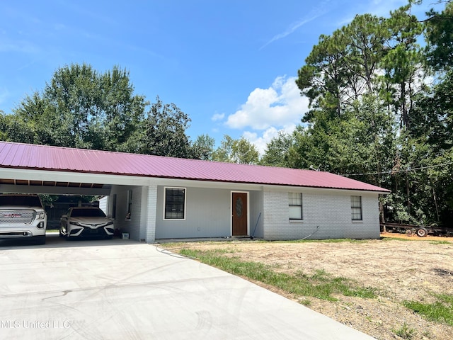 ranch-style home with a carport