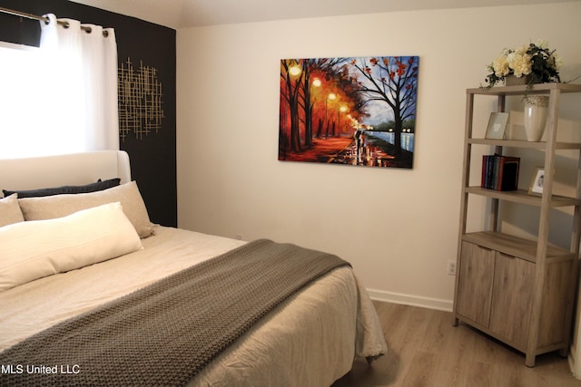 6904 Braybourne Main, Olive Branch, MS 38654 - bedroom with light wood-style flooring and baseboards