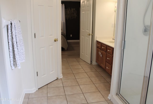 6904 Braybourne Main, Olive Branch, MS 38654 - bathroom with tile patterned flooring, vanity, a shower with door, and baseboards