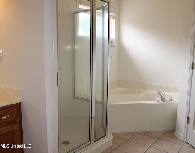 6904 Braybourne Main, Olive Branch, MS 38654 - full bath featuring a stall shower, a bath, tile patterned flooring, and vanity