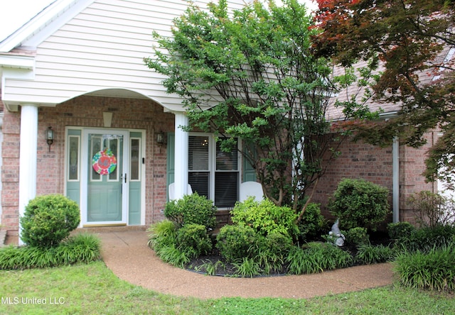 6904 Braybourne Main, Olive Branch, MS 38654 - property entrance featuring brick siding
