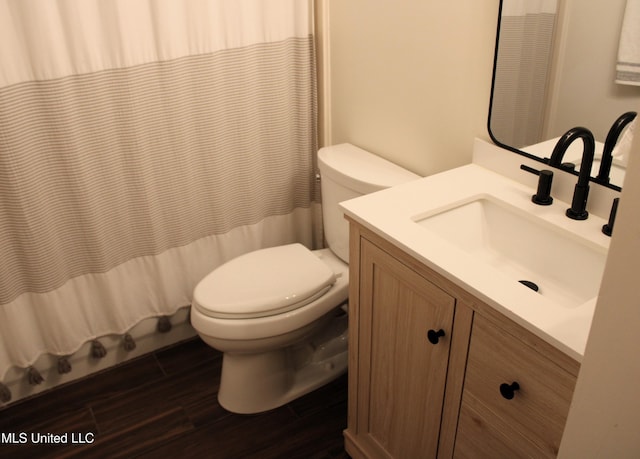 6904 Braybourne Main, Olive Branch, MS 38654 - bathroom featuring toilet, wood finished floors, vanity, and a shower with shower curtain