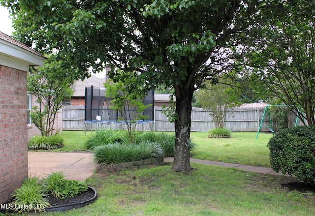6904 Braybourne Main, Olive Branch, MS 38654 - view of yard with a trampoline and a playground