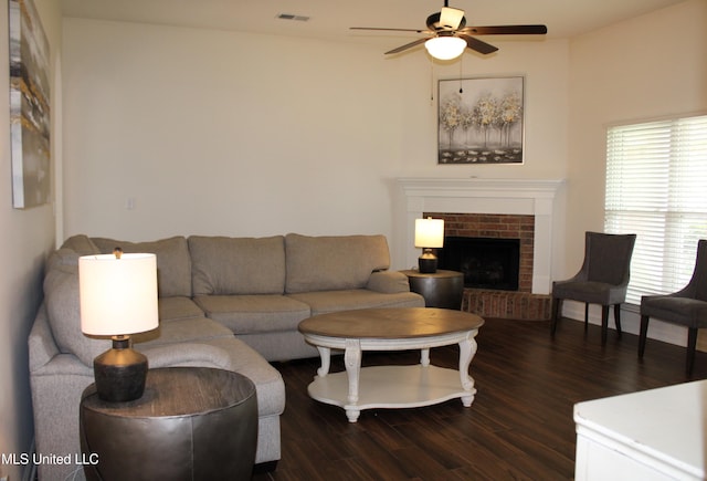 6904 Braybourne Main, Olive Branch, MS 38654 - living area featuring a ceiling fan, dark wood-type flooring, and a brick fireplace