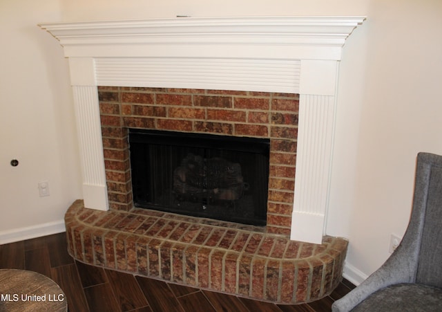 6904 Braybourne Main, Olive Branch, MS 38654 - detailed view of wood finished floors, baseboards, and a fireplace