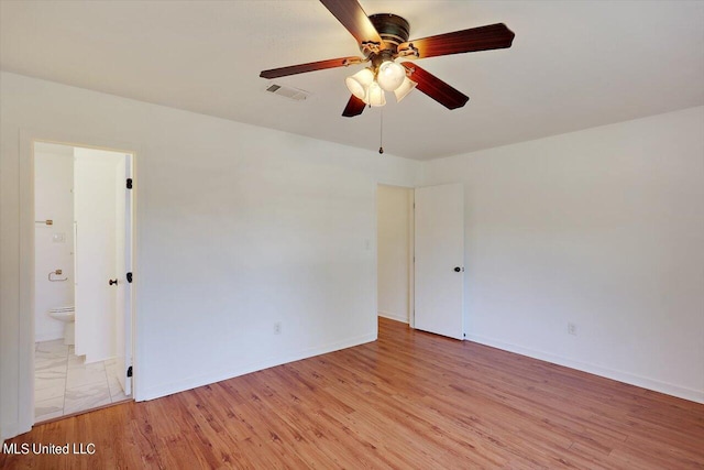 empty room featuring light hardwood / wood-style floors and ceiling fan